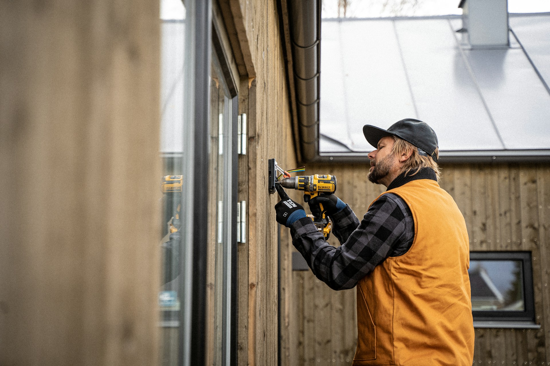 Electrician working on an exterior fitting